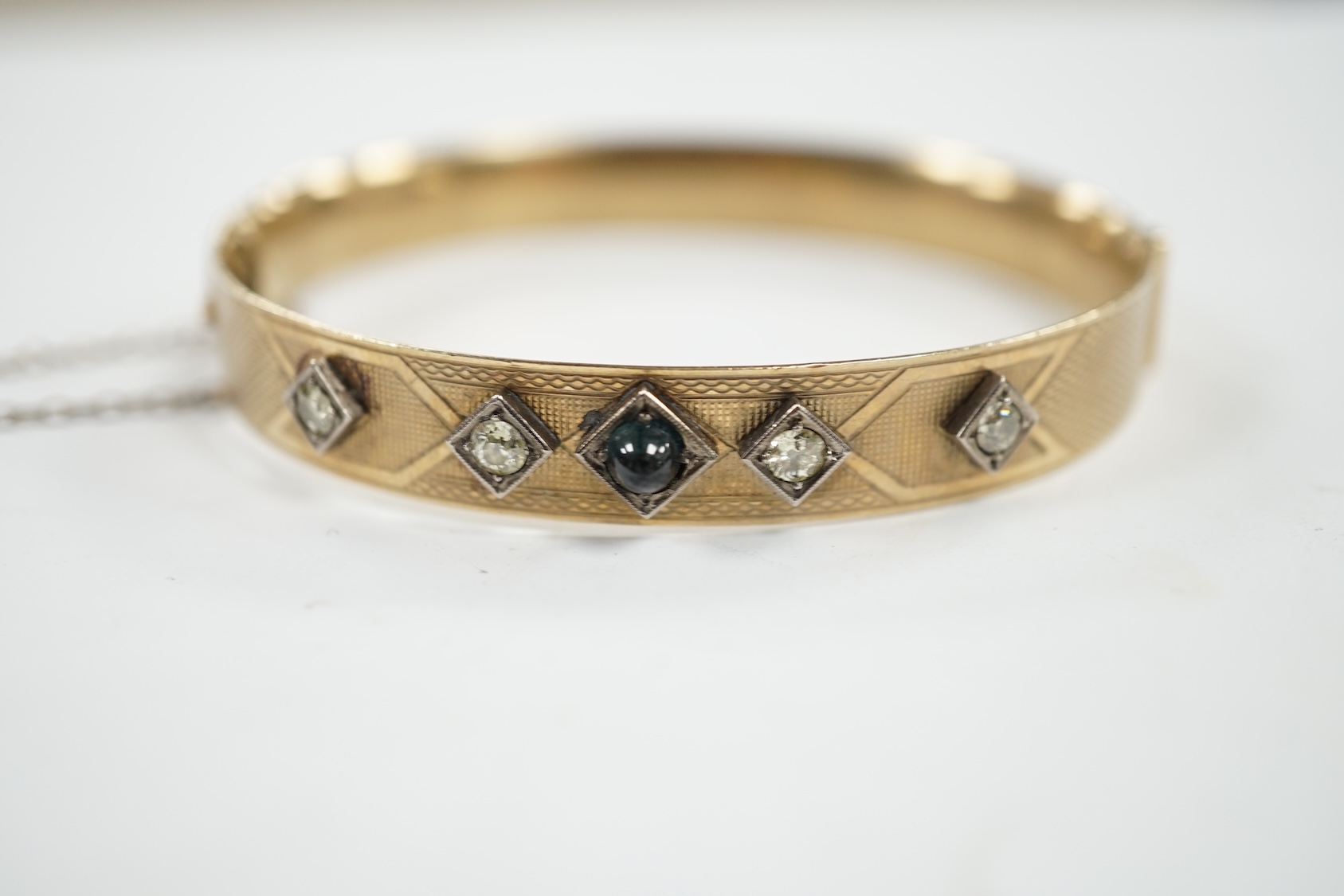 A Lagarmic diamond and green cabochon set 9ct and bronze core hinged bangle. Condition - fair